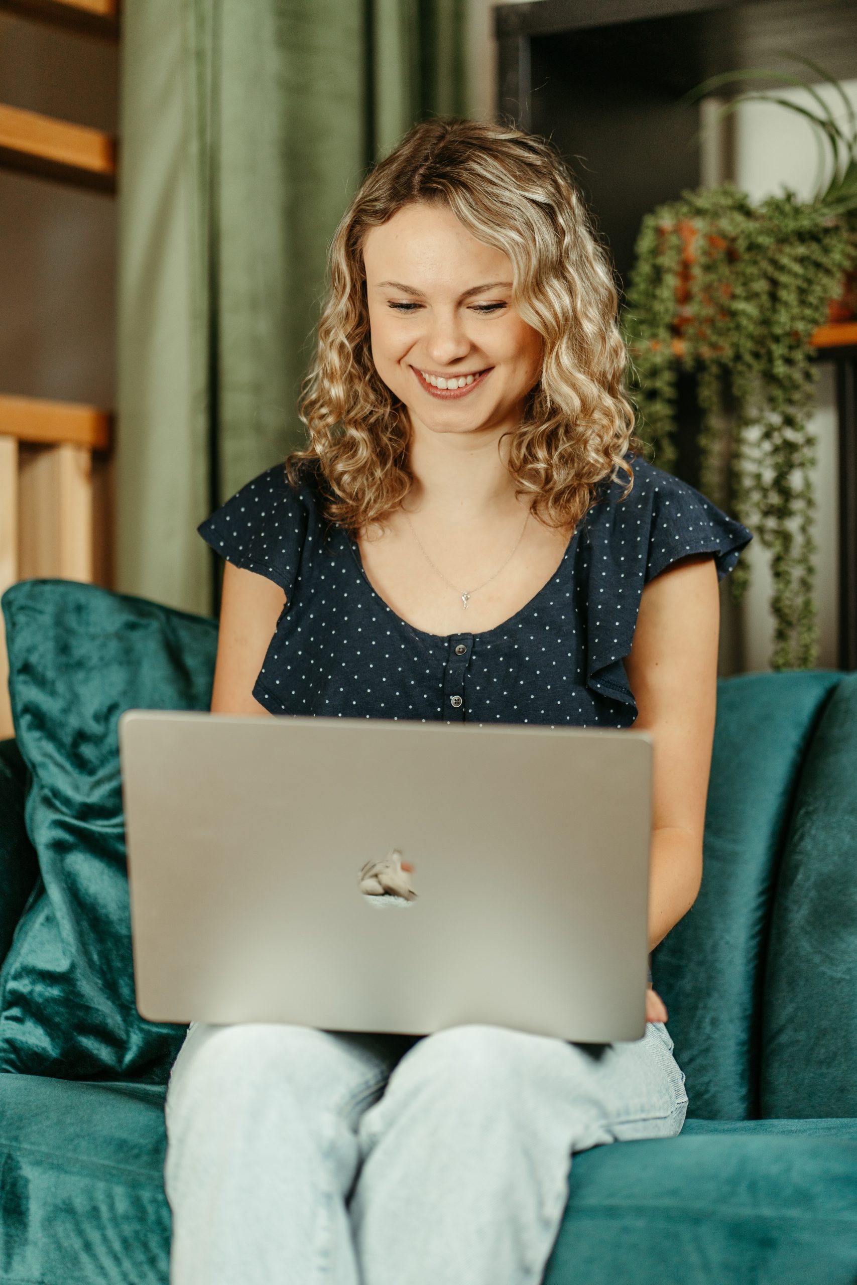 Portrait of Noelle Knipe sitting on a couch
